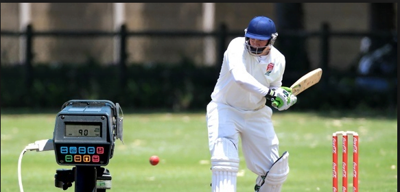 A bowling machine and a batsman